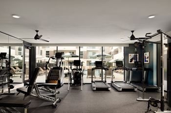 Glass-enclosed fitness center with yoga flex room